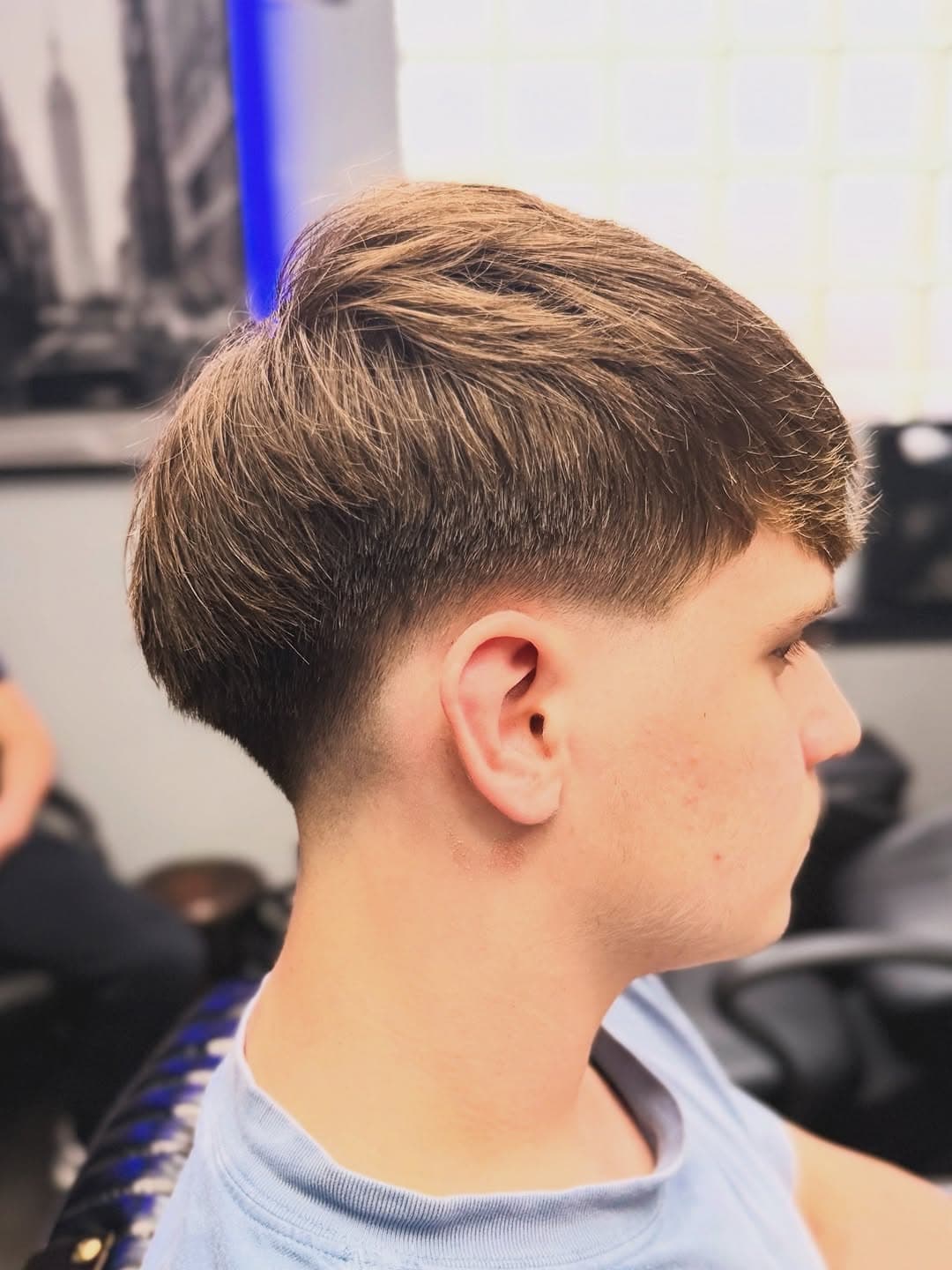Low taper fade with textured layered top