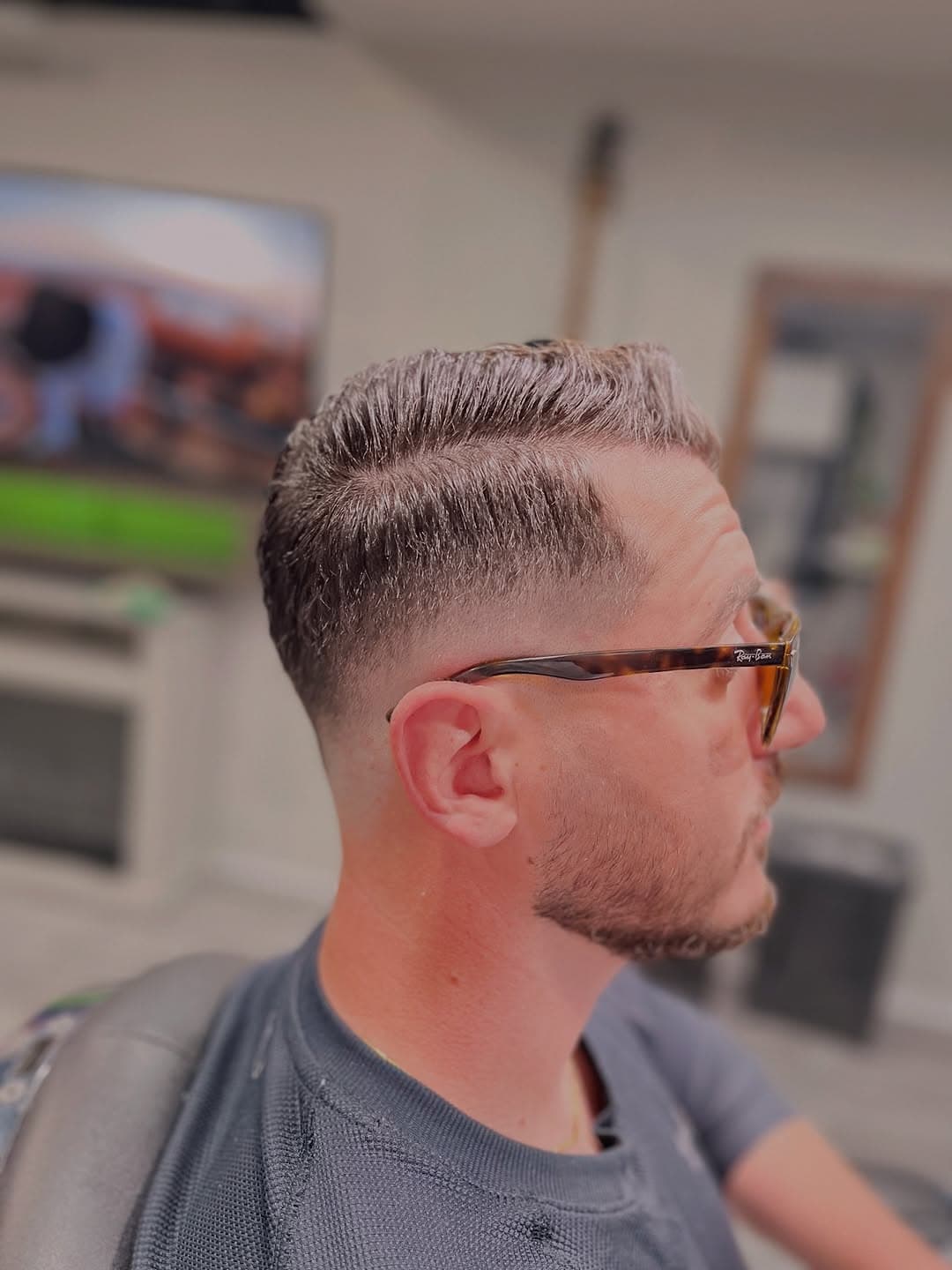 Side part with mid fade and clean beard trim